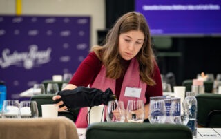 Kate Barry pouring wine