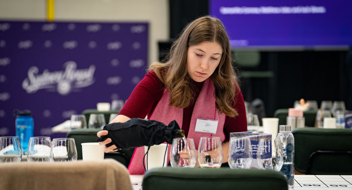Kate Barry pouring wine