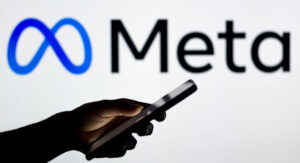 Meta logo behind person using their phone
